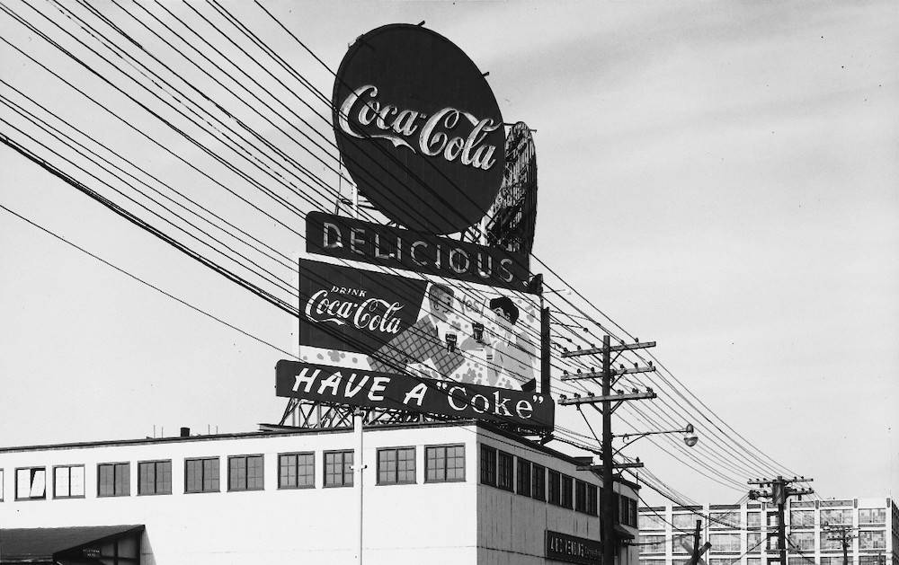 Coca-Cola have a coke billboard advertisement sign 1950s