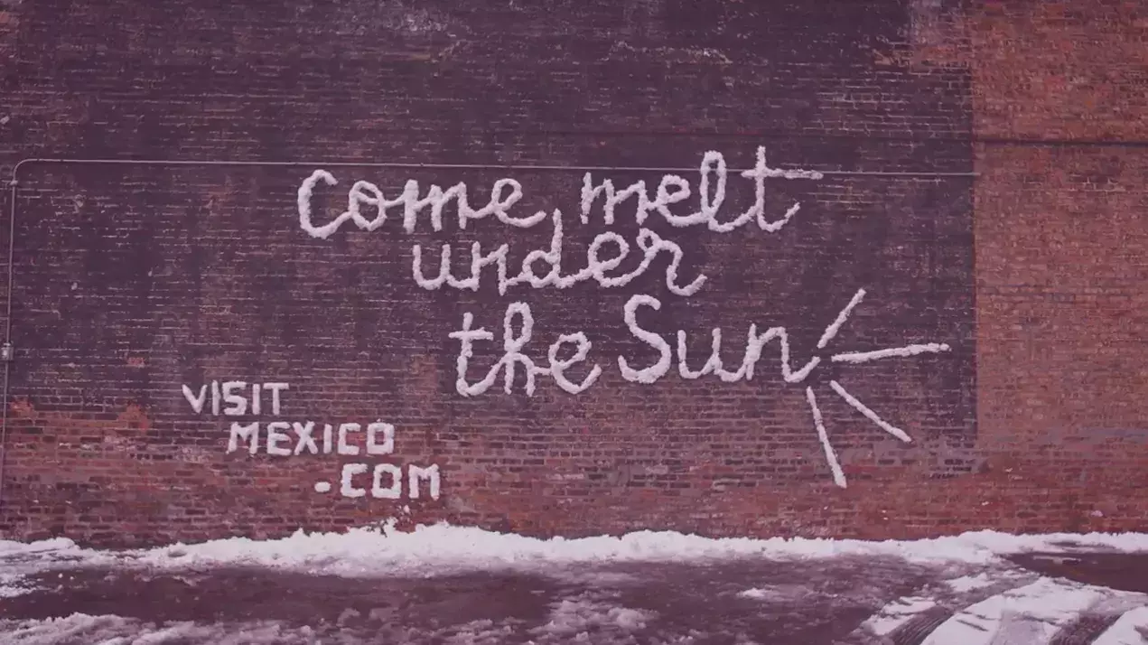 come melt under the sun snow billboard sign